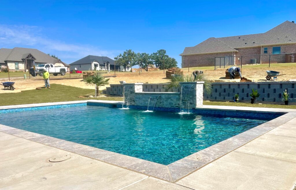 New pool installation with triple wall fountains